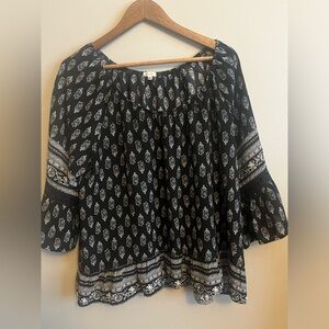 Large, black floral 3/4 length sleeves.